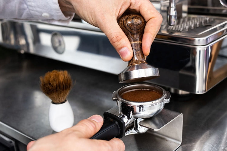Black handle coffee tamper for home espresso.