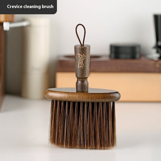 Crevice cleaning brush with wooden handle and bristles on a blurred background