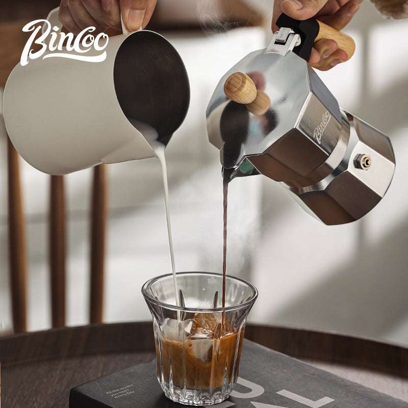 Isolated black Italian moka pot, classic stovetop coffee maker design