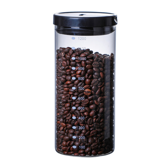 A close-up, front-facing shot of the 1000ml airtight glass canister filled with coffee beans. Shop now