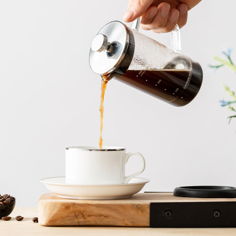 Pouring freshly brewed coffee from CAFEDE KONA French Press into cup. Easy to use coffee maker. #CoffeePour #MorningCoffee #CoffeeLover