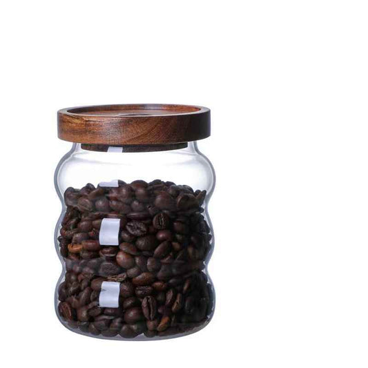 Glass jar filled with coffee beans and a wooden lid Shop now!