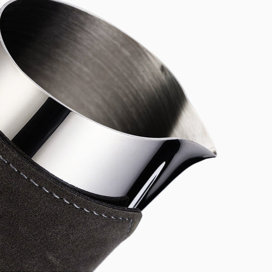 Metallic pitcher with a black sleeve