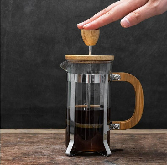 French press with wooden lid and handle on a dark background - shop now! Free shipping!