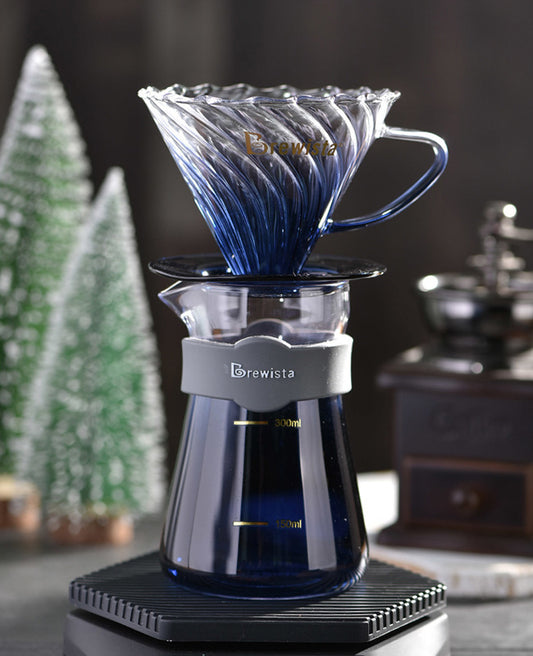 Blue coffee dripper with Brewista logo on a dark background