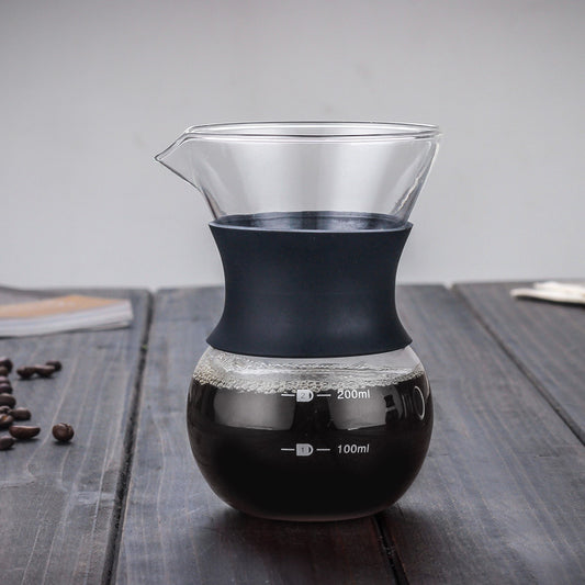 200ml pour-over glass coffee carafe filled with coffee on a wooden surface.