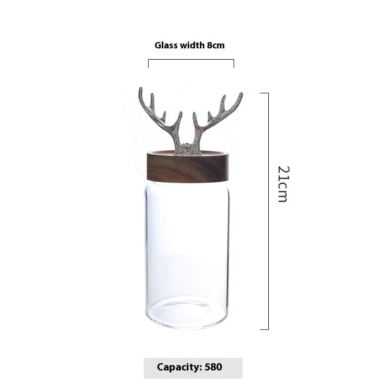 Glass container with deer antler design on a white background, showing measurements and capacity.