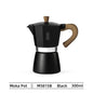 Black moka pot with wooden handle on a white background