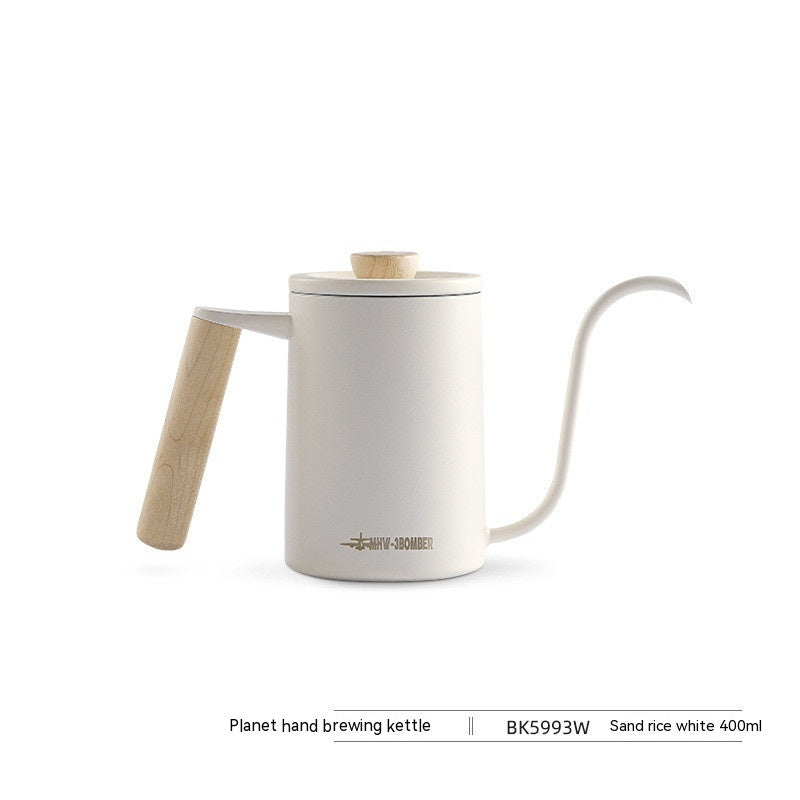 White hand brewing kettle with wooden handle on a white background