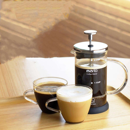 Mario French Press Coffee Maker with two cups of brewed coffee and frothy latte. Perfect home coffee setup. #FrenchPress #CoffeeTime #HomeBrew