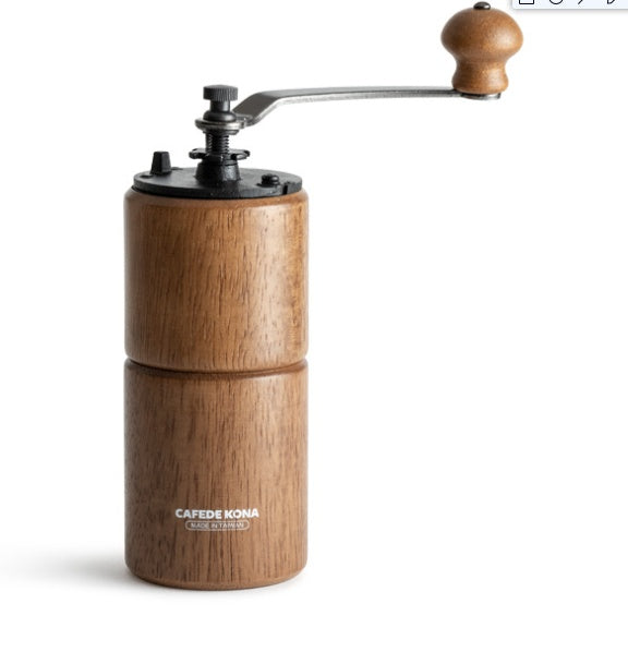 CAFÉDE KONA manual coffee grinder dark wood with shadow, natural finish.

