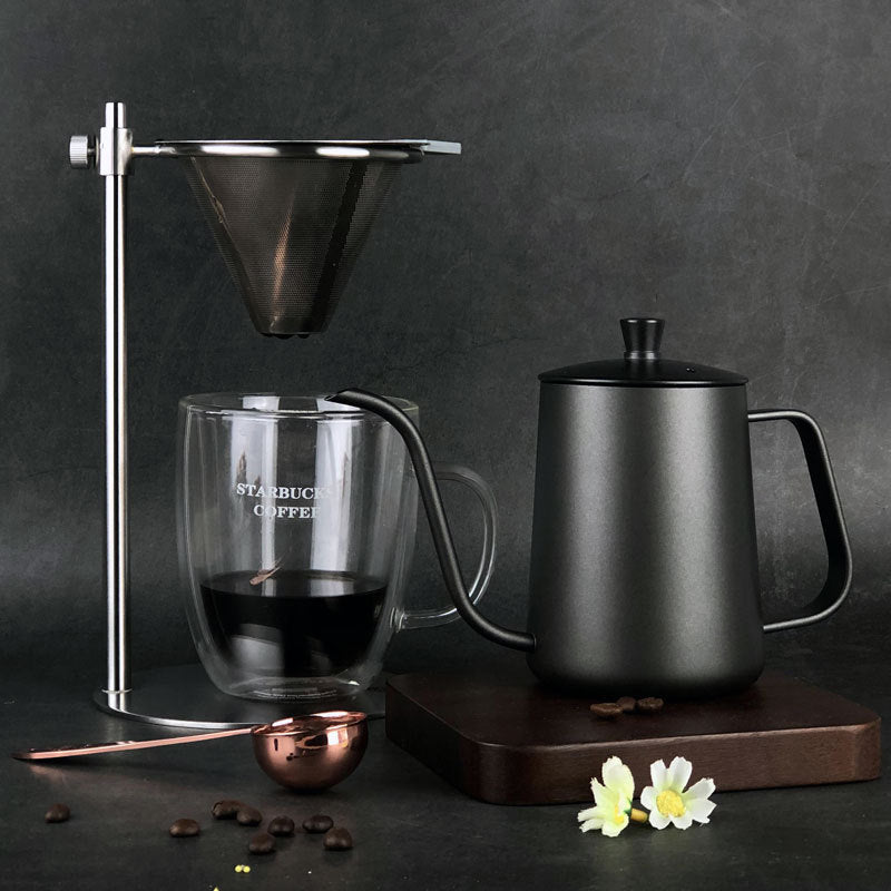 Full pour-over coffee brewing setup with black gooseneck kettle, glass mug, and coffee filter. Perfect for home coffee lovers. #CoffeeLover #BrewAtHome