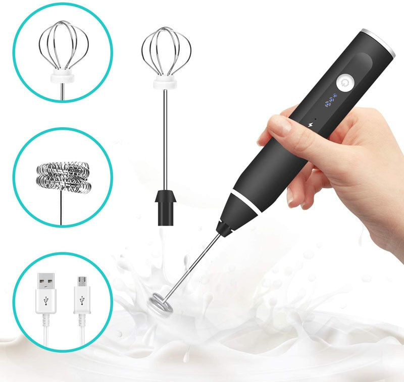 Handheld milk frother in action, creating foam in milk. Features balloon whisk, frothing whisk, and USB port. Shop NOW
