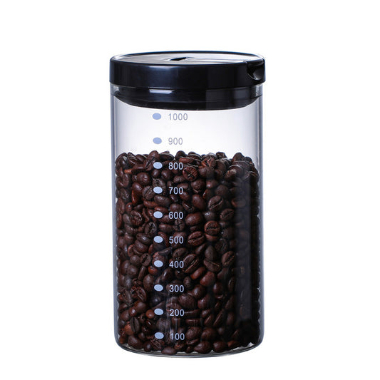 A close-up, front-facing shot of the 1000ml airtight glass canister filled with coffee beans. Shop now