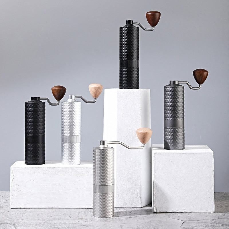  Assortment of premium manual coffee grinders in black, silver, and gray. Perfect gift for coffee enthusiasts. #CoffeeGifts #ManualGrinderCollection #CoffeeTools