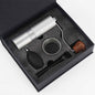 Premium silver manual coffee grinder gift set with cleaning accessories.