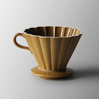 Brown ceramic coffee filter on a gray background SHOP NOW