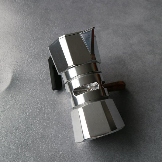 Assembled silver Hexagon Moka Pot. Stovetop coffee maker with wood handle. Home espresso brewer.