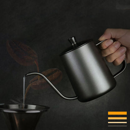 Hand pouring water from a black gooseneck kettle into a coffee filter. Perfect pour-over technique for rich coffee. #PourOverCoffee #Brewing

