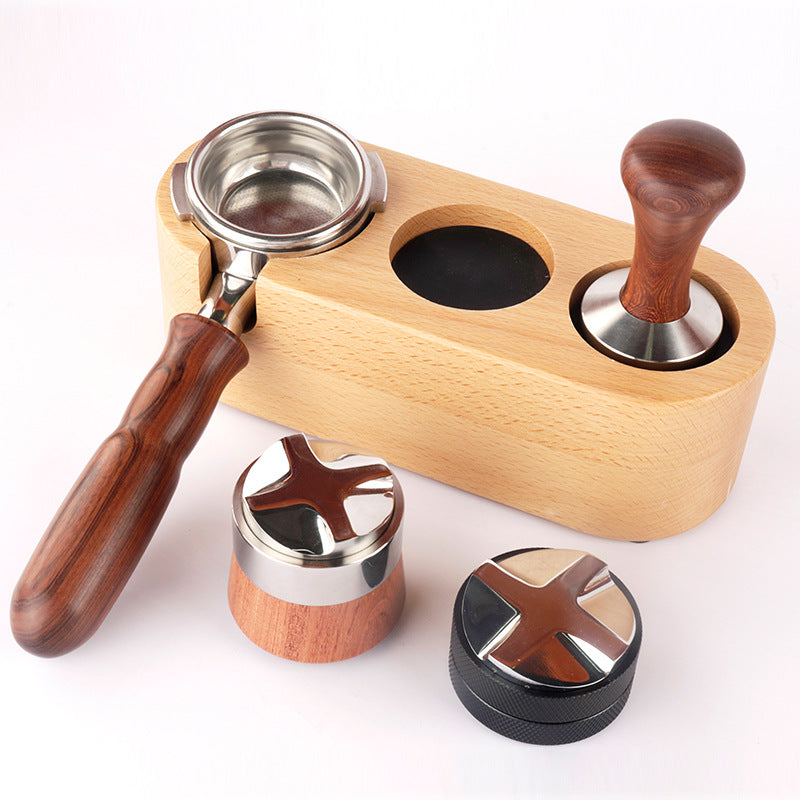 A solid beechwood espresso tamping station with three circular slots and a portafilter holder. The station is designed to organize and hold coffee tools like a tamper, distributor, and a portafilter, preventing scratches on the countertop. Shop- now!
