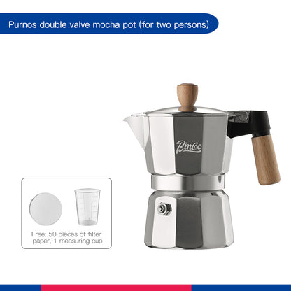 Inside view of black moka pot's upper chamber and percolator, demonstrating interior design.