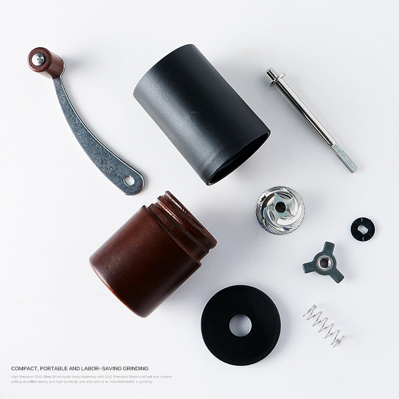 Disassembled manual coffee grinder parts showing internal mechanism. Easy to clean and maintain.