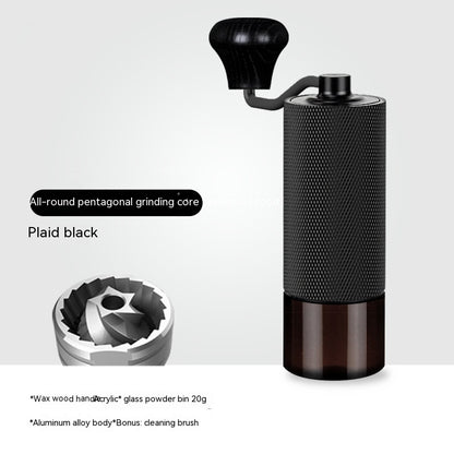 Black manual coffee grinder with glass bin, pentagonal core for precise home coffee grinding.