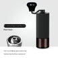 Black manual coffee grinder with glass bin, pentagonal core for precise home coffee grinding.