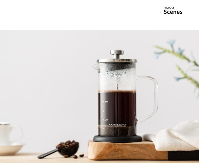 CAFEDE KONA 350ml French Press with brewed coffee on wooden board. Ideal home coffee maker. #FrenchPress #CoffeeTime #HomeBarista