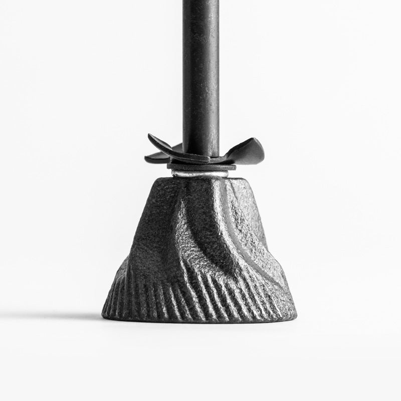 Close-up of CAFÉDE KONA manual coffee grinder cast iron burr and grinding mechanism.