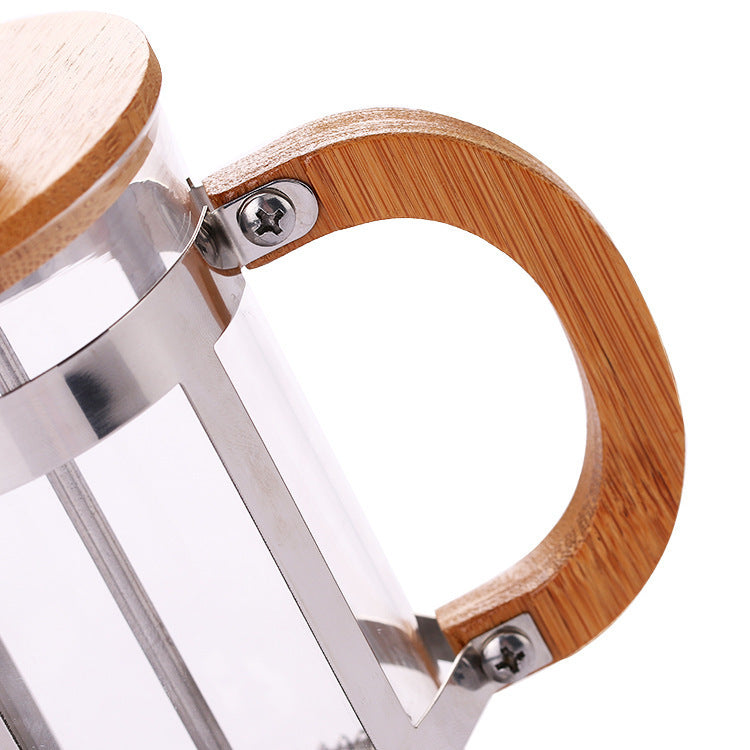 Close-up view of the natural bamboo lid and rounded knob of the Nordic Glass & Bamboo French Press.