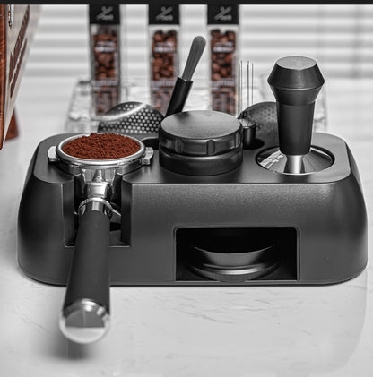 Coffee grinder with various attachments on a light surface