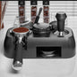 Coffee grinder with various attachments on a light surface