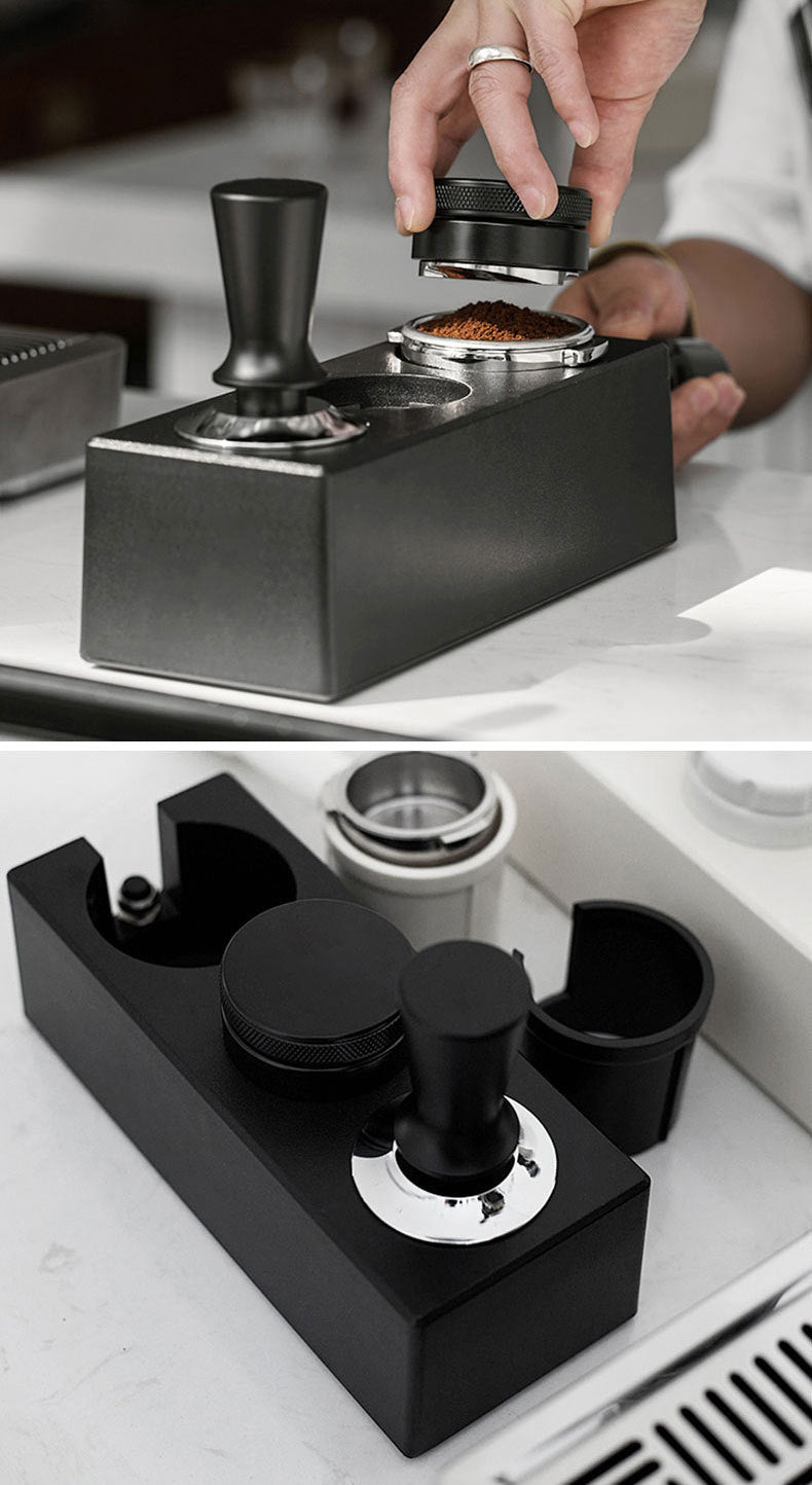 Coffee tamp being used on a black coffee tamp press with a close-up of the tamp mechanism.