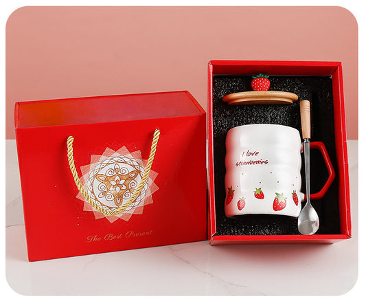 Gift set with a mug, spoon, and strawberry decoration in a red box. GIFT BOX PRESENT
