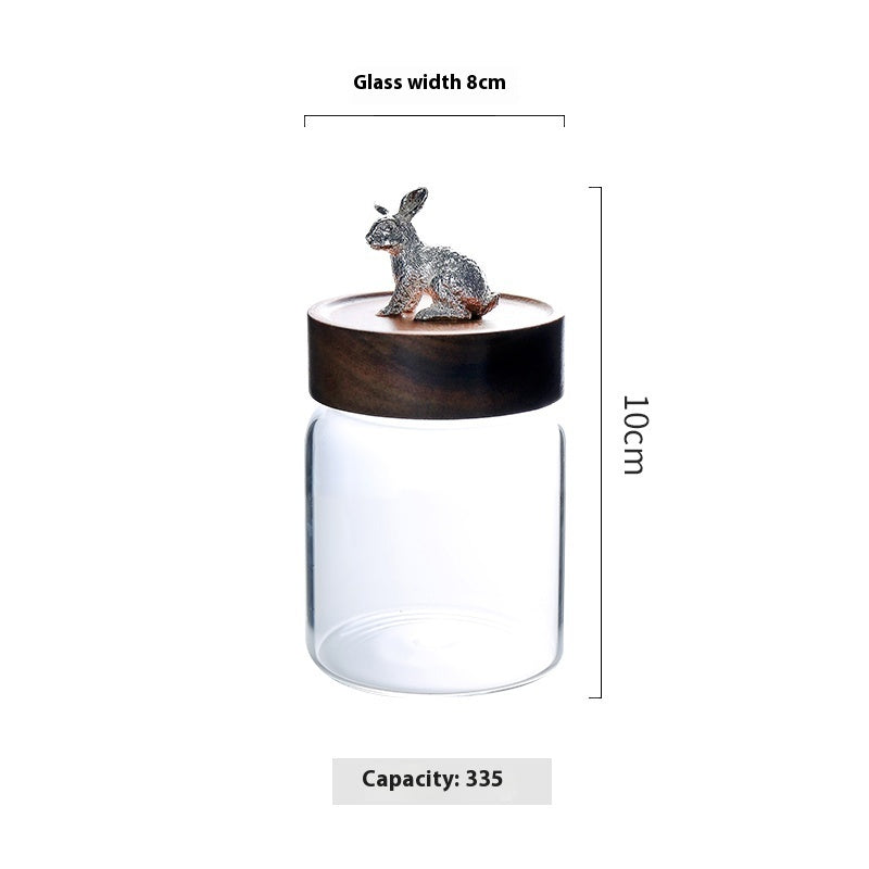 Glass jar with wooden lid featuring a rabbit ornament