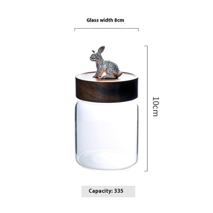 Glass jar with wooden lid featuring a rabbit ornament