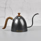 Gray Brewista kettle with wooden handles on a light gray background