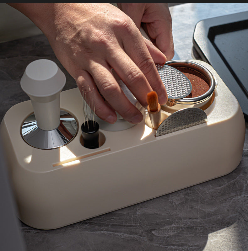 Hand interacting with a grooming tool on a marble surface