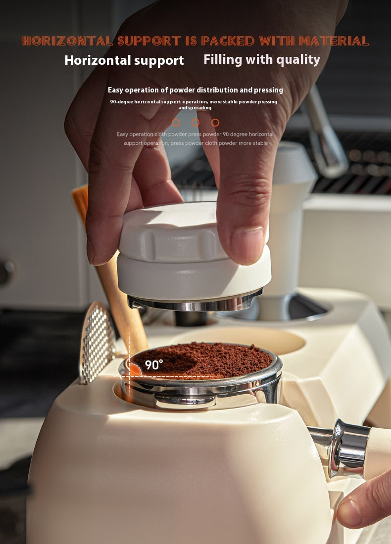 Hand using a coffee grinder with coffee beans being ground.