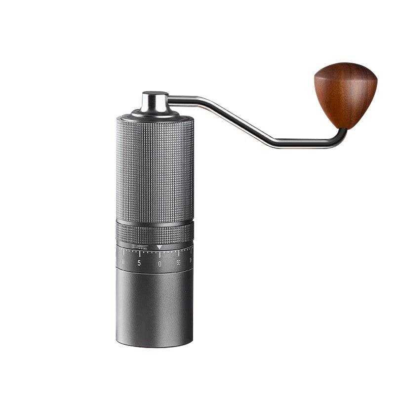 Deep Space Gray manual coffee grinder with wooden handle, isolated on white background. Portable and stylish coffee accessory