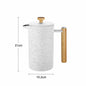 White speckled milk frother with wooden handle and measurements on a white background