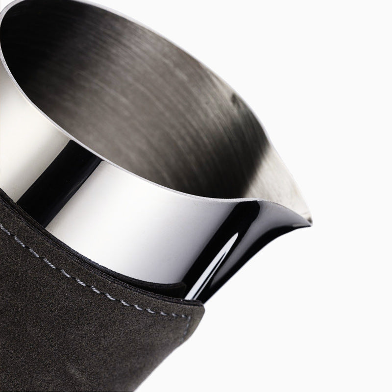 Metallic pitcher with a black sleeve 