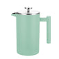 Mint green French press coffee maker on a white background