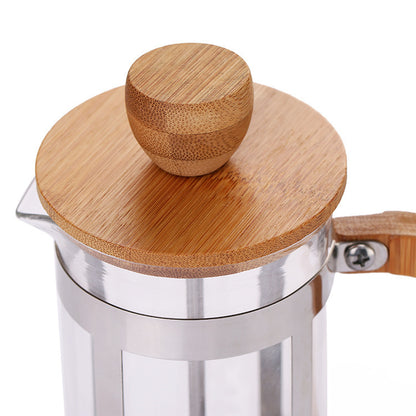 Glass French press with wooden lid and handle on a white background - Shop now + Free shipping