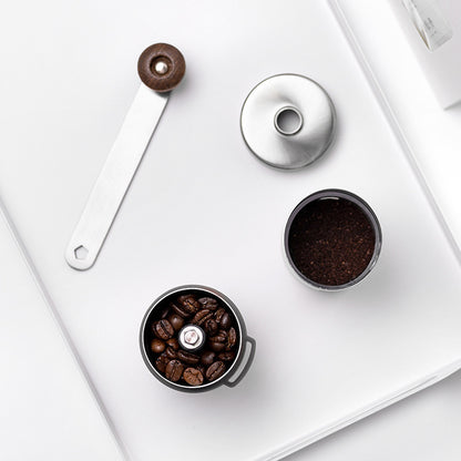  Disassembled manual coffee grinder showing whole beans and ground coffee. Easy to clean, perfect for fresh home brewing.