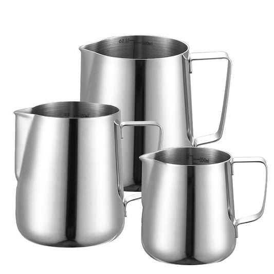 Set of three stainless steel milk pitchers on a white background Shop now!
