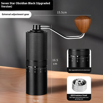 Black coffee grinder with wooden handle on a wooden surface, showing measurements and component details.