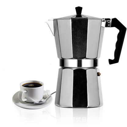 Stainless steel espresso maker with a cup of coffee 