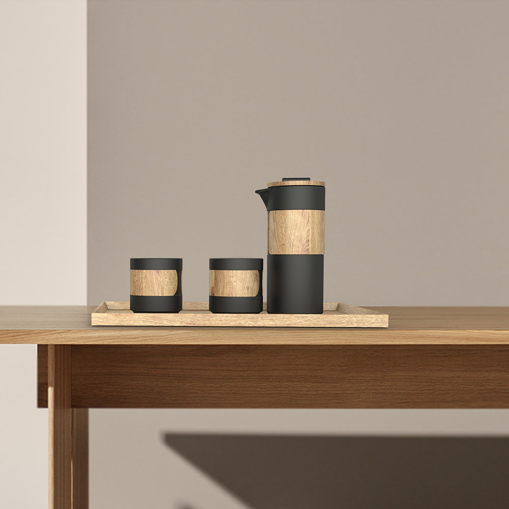 DOHO black ceramic coffee press and cups on wooden table, modern home decor, aesthetic coffee brewing, interior design.